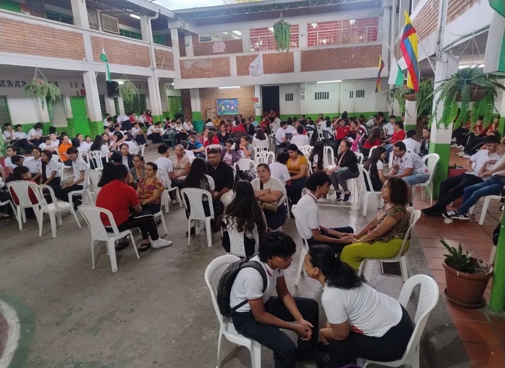 Families in paired dialogue during a resilience workshop